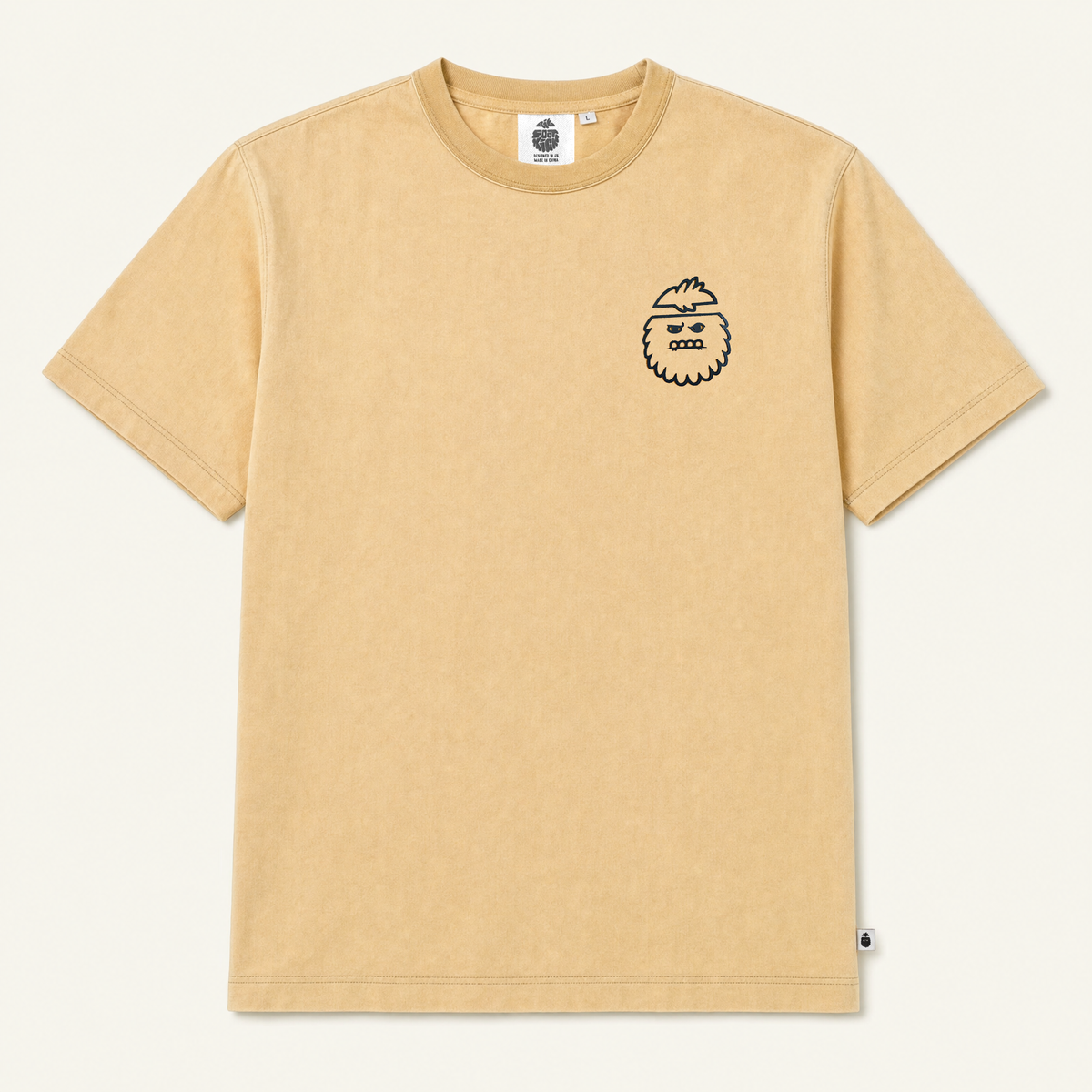 Bigfoot Kick Dreamsicle Tee - a light orange vintage washed shirt with a bigfoot logo on the chest