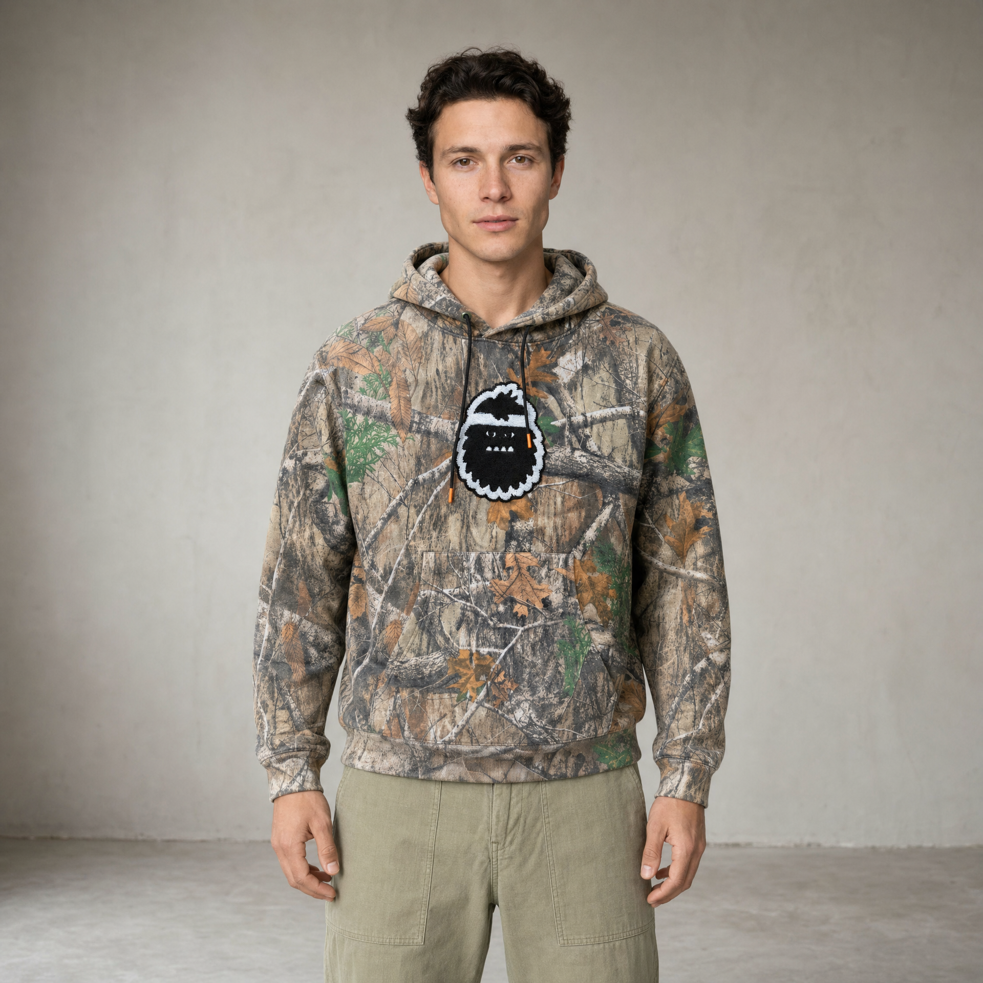 Man wearing Bigfoot Kick camo hoodie