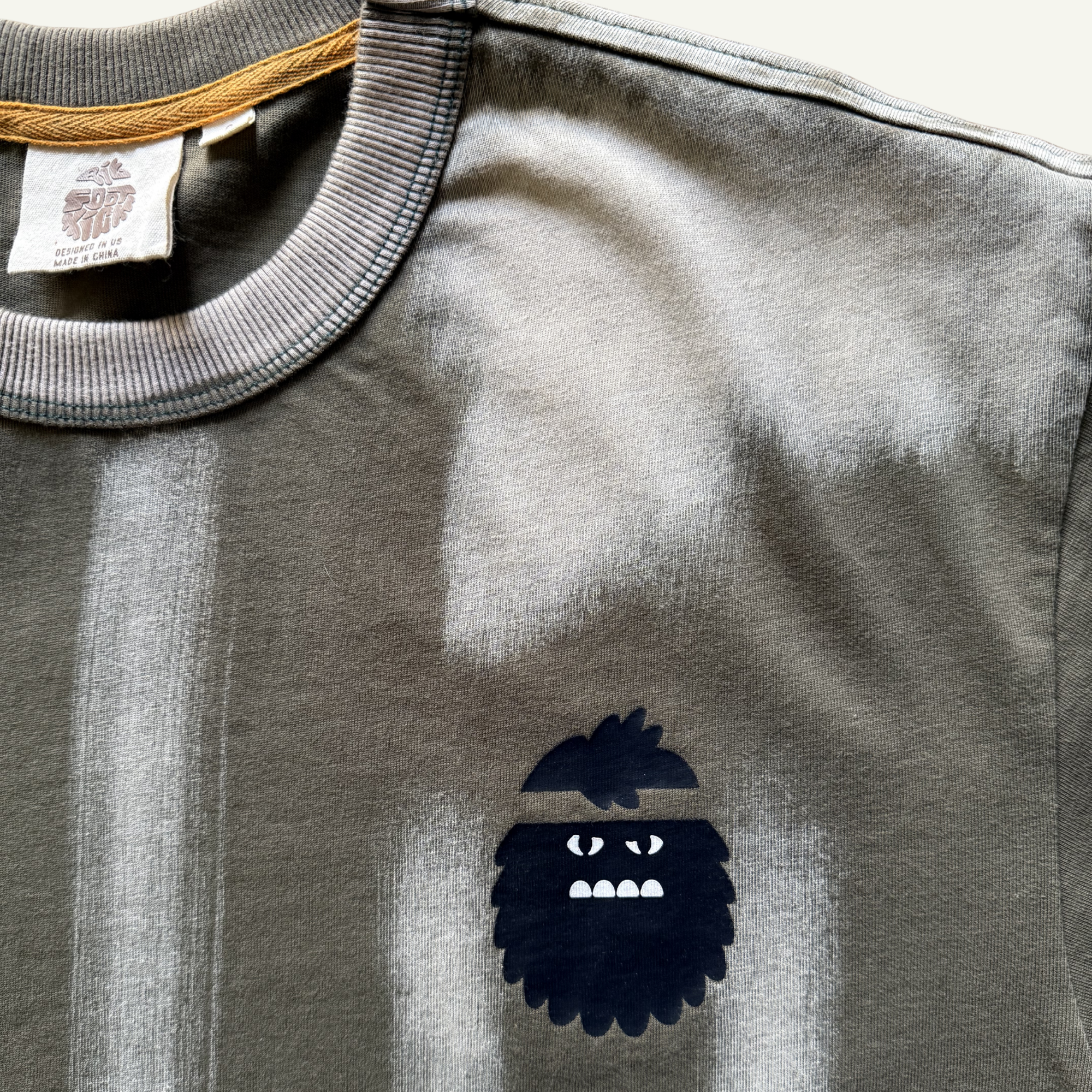 Bigfoot Kick Logo Detail on Weathered Remains Tee